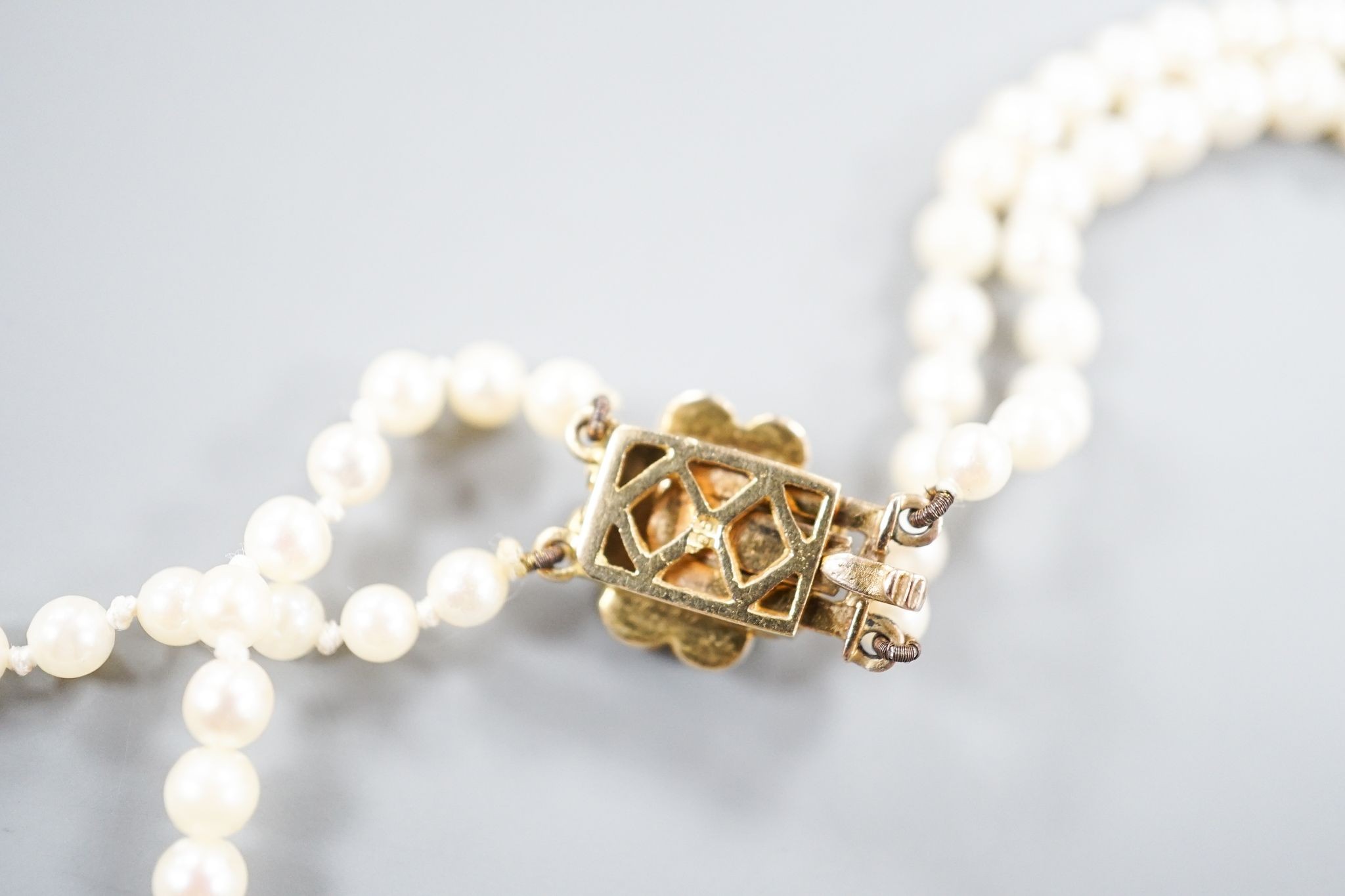 A double strand cultured pearl necklace, with 9ct and cultured pearl cluster clasp, 43cm.